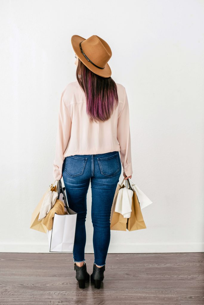 girl from behind with shopping bags