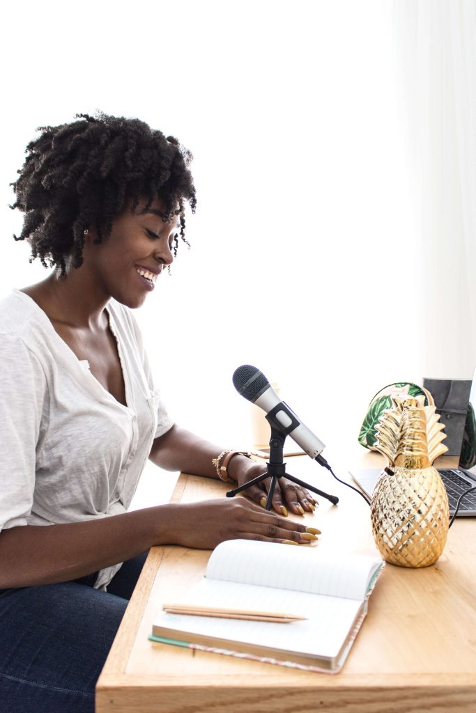 black girl in front of microphone